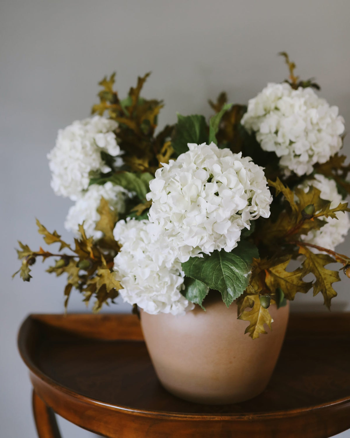 Artificial Fall Oak Branches and hydrangeas in a vase