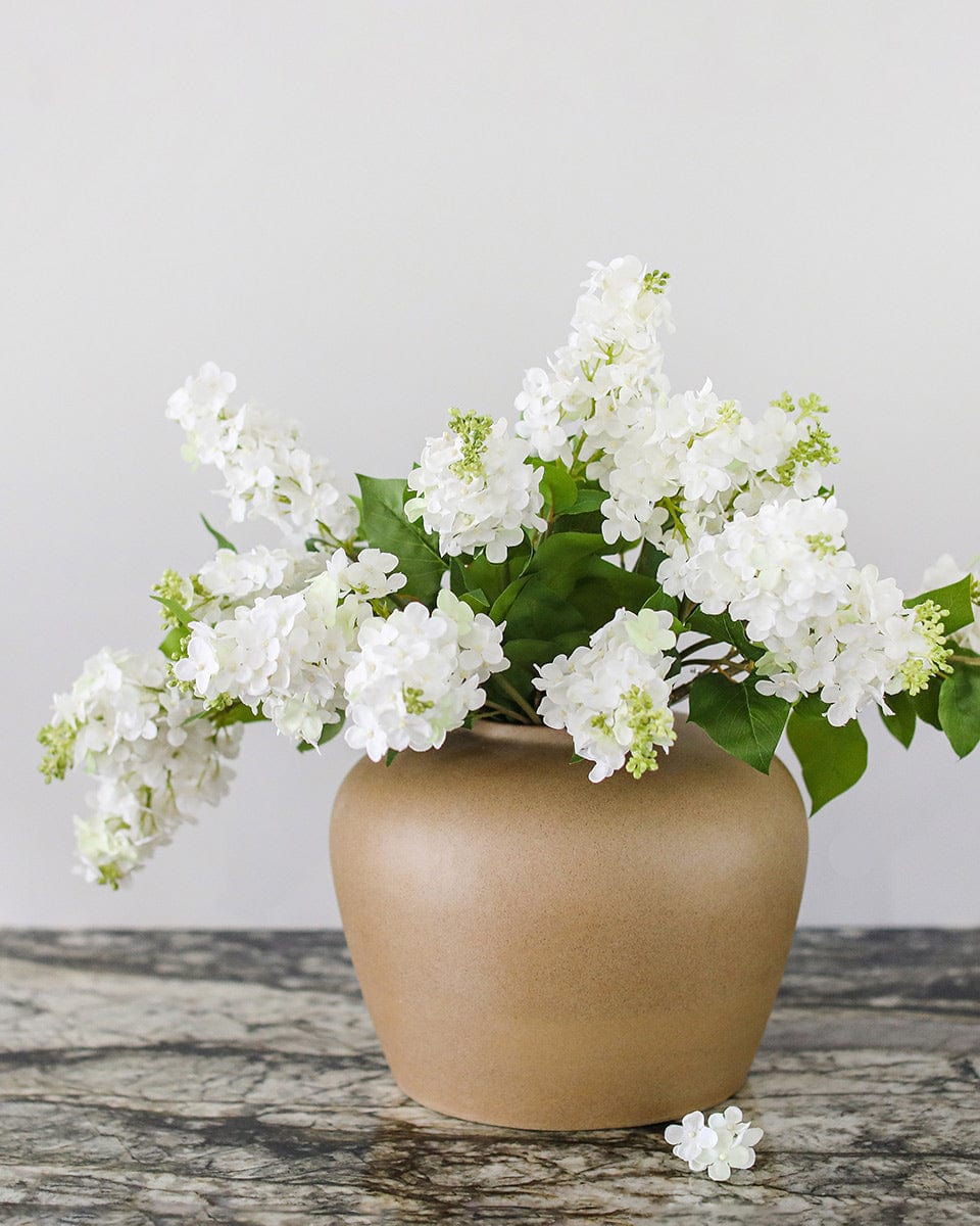 Prestige Botanicals Artificial White Lilac stems in a Tan Ceramic Vase
