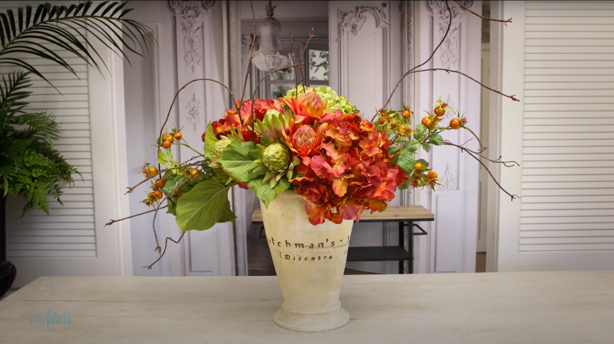A Fall Floral Design of Hydrangea, Twisted Willow, Rose hip, Waratahs