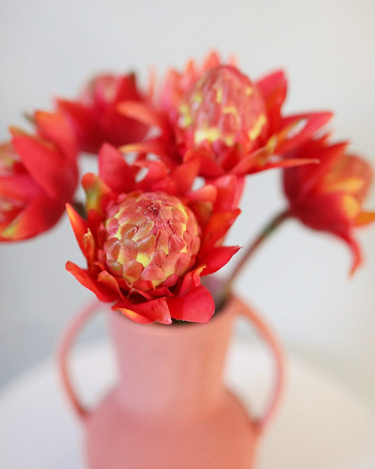 Prestige Botanicals Artificial Green and Orange Waratahs in a white tin vase