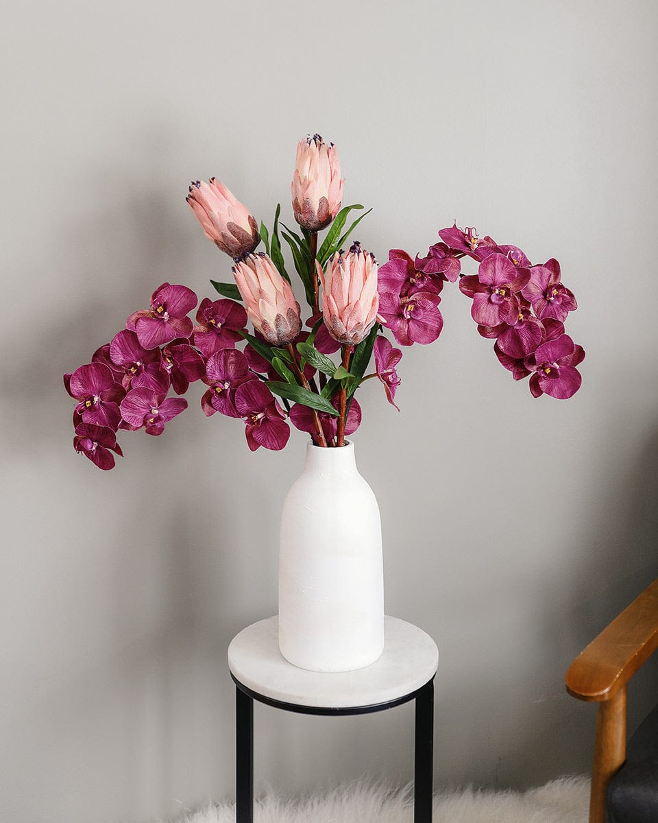 Fake Flower Display with Phalaenopsis Orchids and Mink Proteas in Pink Color