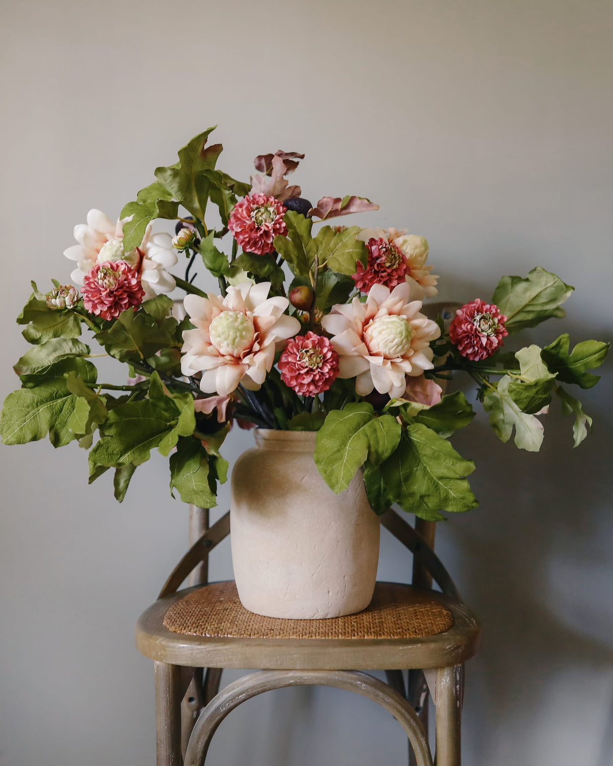 faux arrangement of fig, waratah and dahlia