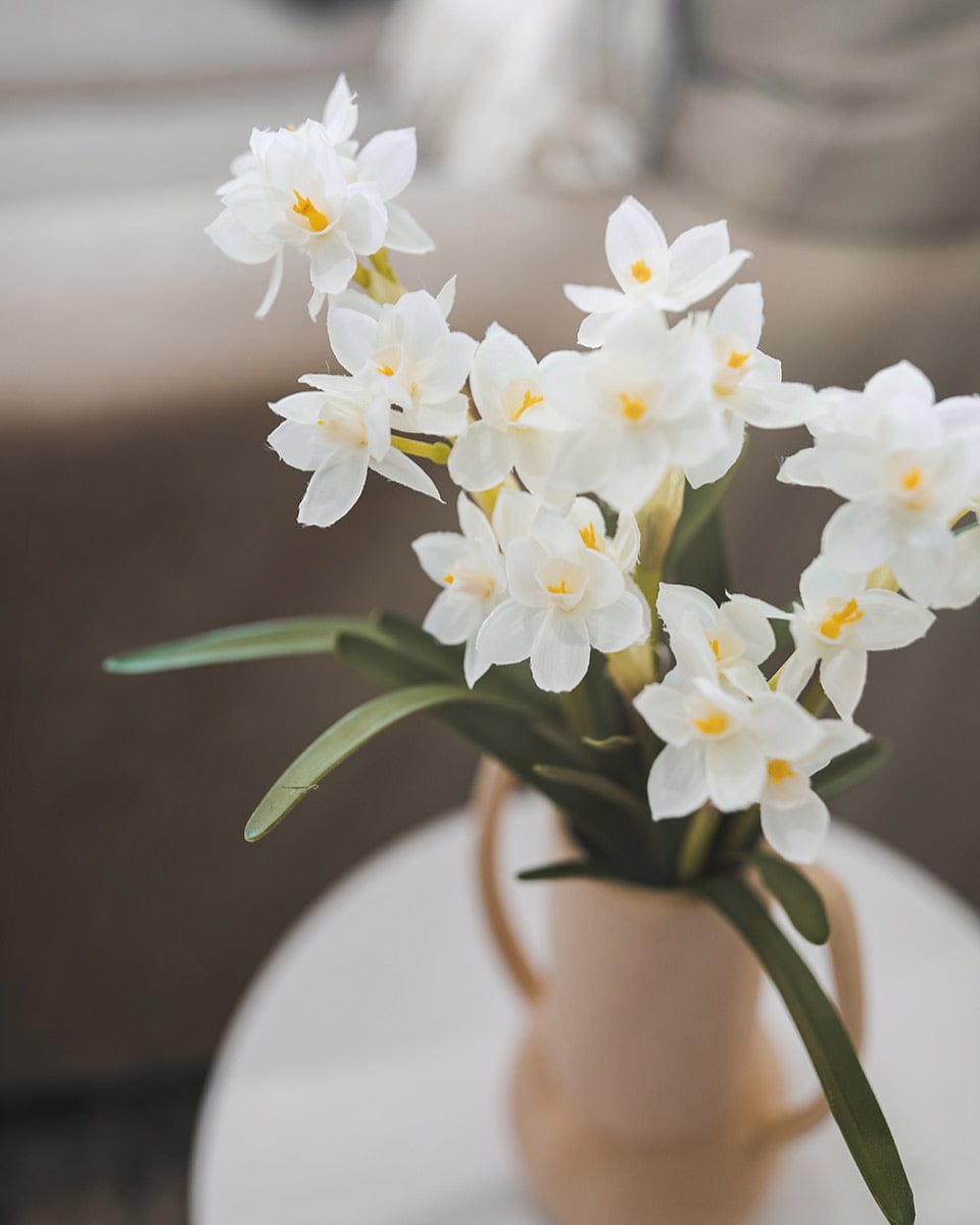 Fake White Narcissus Flowers in Pink Ceramic Vase