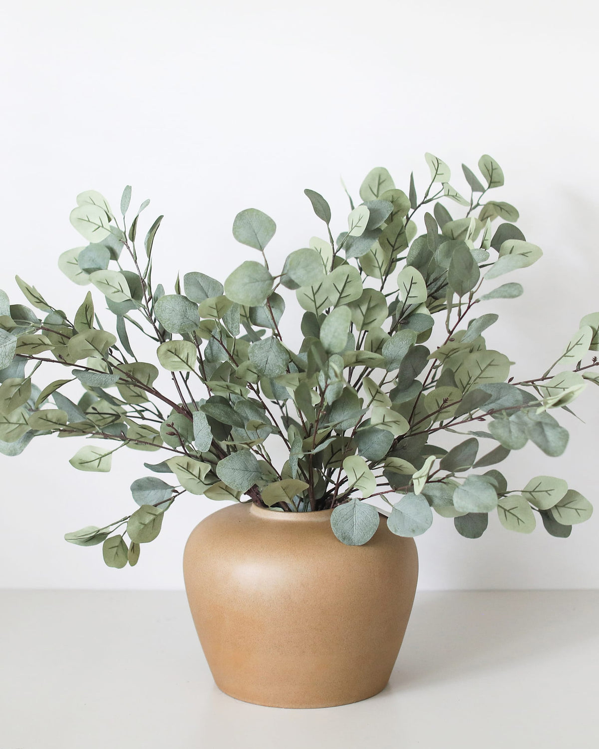 Faux Eucalyptus Leaves in Ceramic Vase