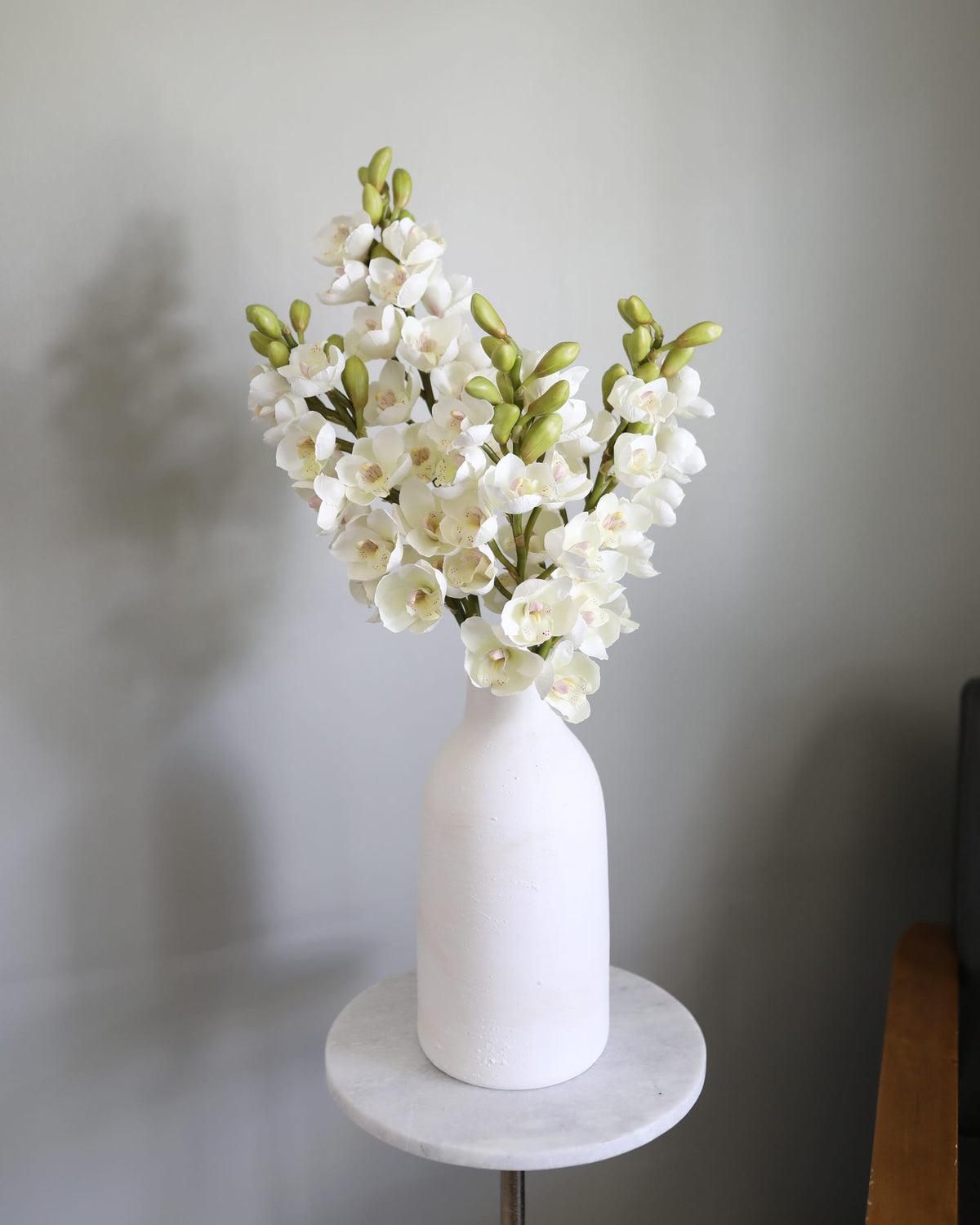 Faux Cream Cymbidium Orchids in a vase