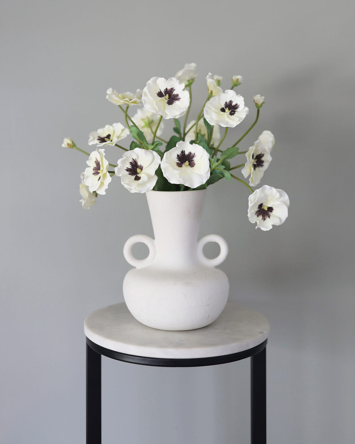 Artificial White Pansies in a vase