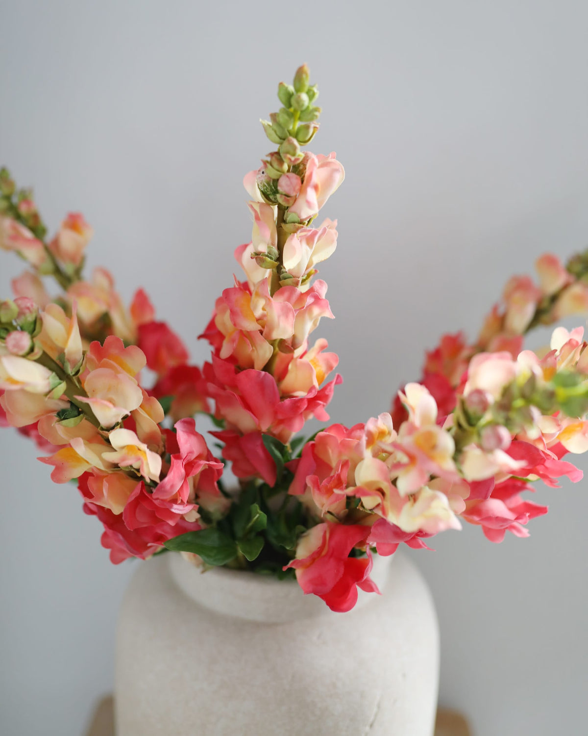 faux snapdragons in a vase