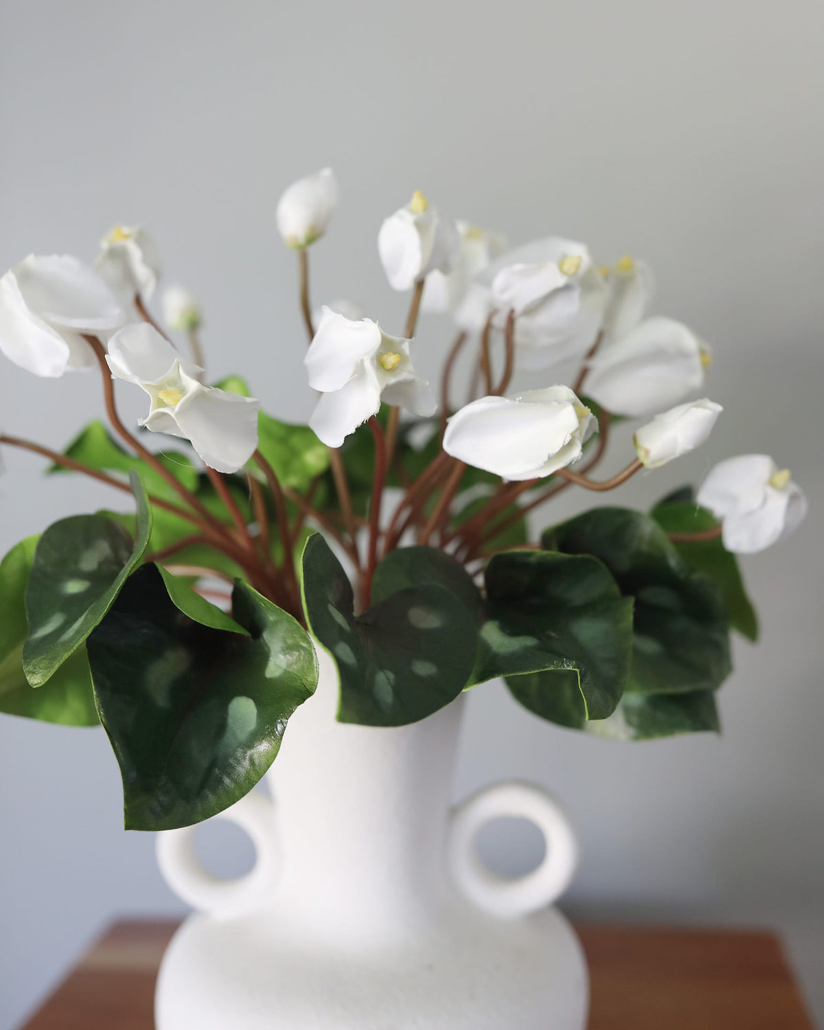 Faux Cyclamen bundles in a vase