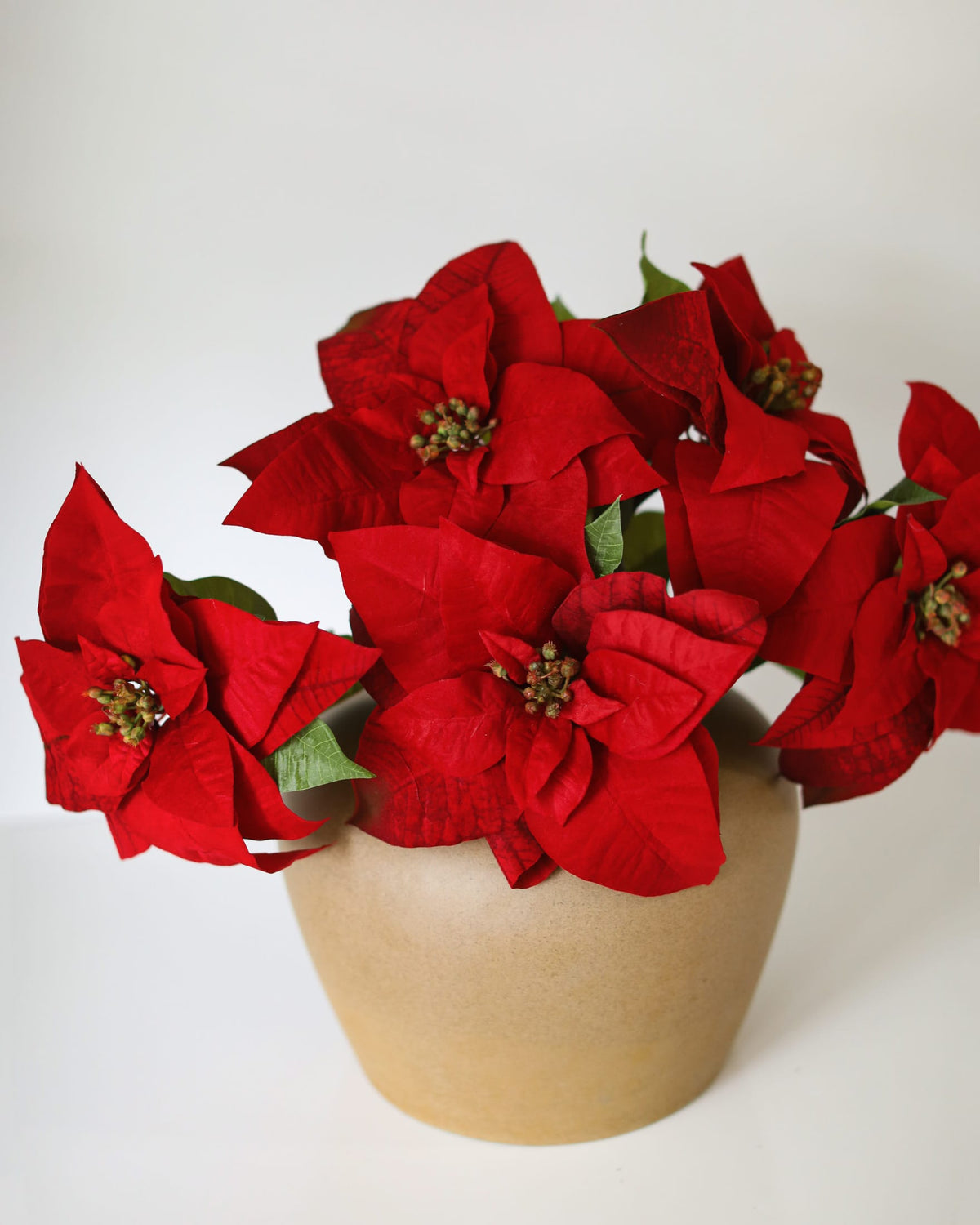 Artificial Red Poinsettias in a cvase