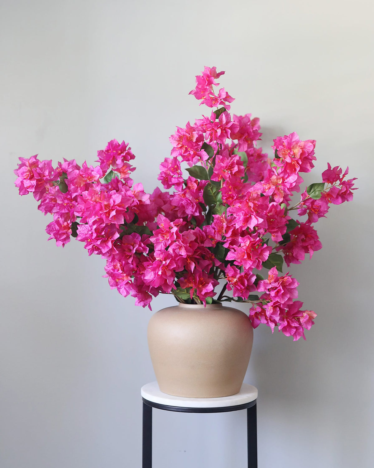 Artificial Fuchsia Bougainvillea stems in a vase