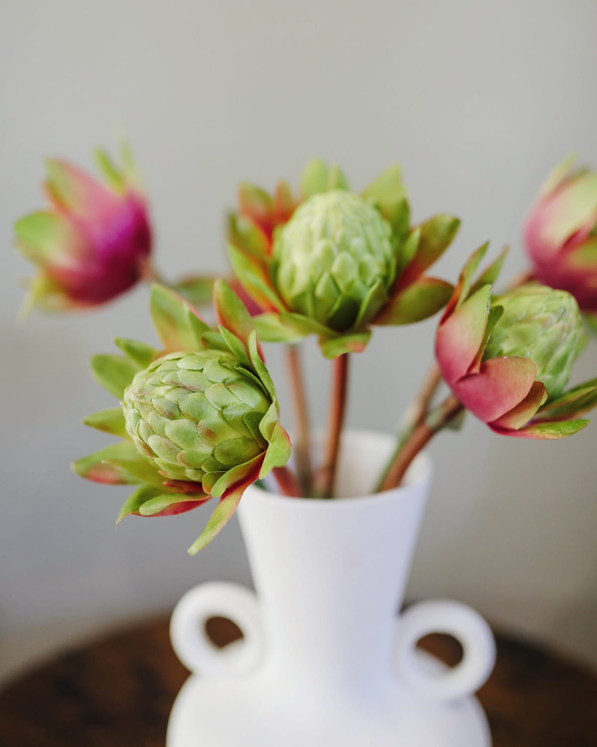 faux green waratahs in a vase 