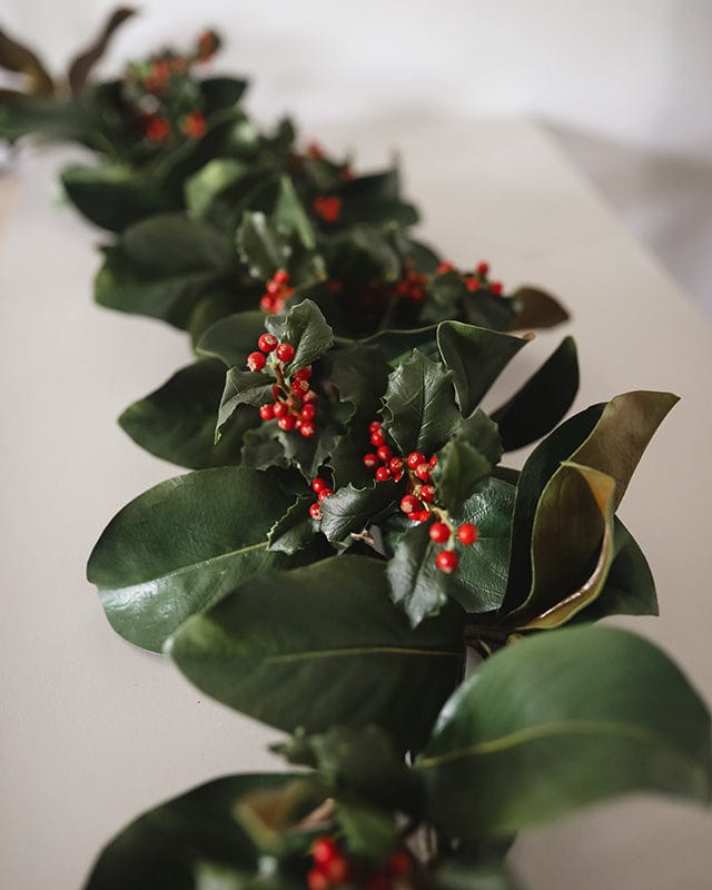 Faux Magnolia Leaf Garland with Red Artificial Holly Berries