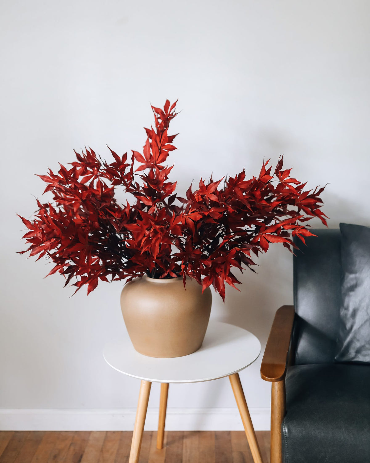 imagery of Faux Maple Leaves in Vase