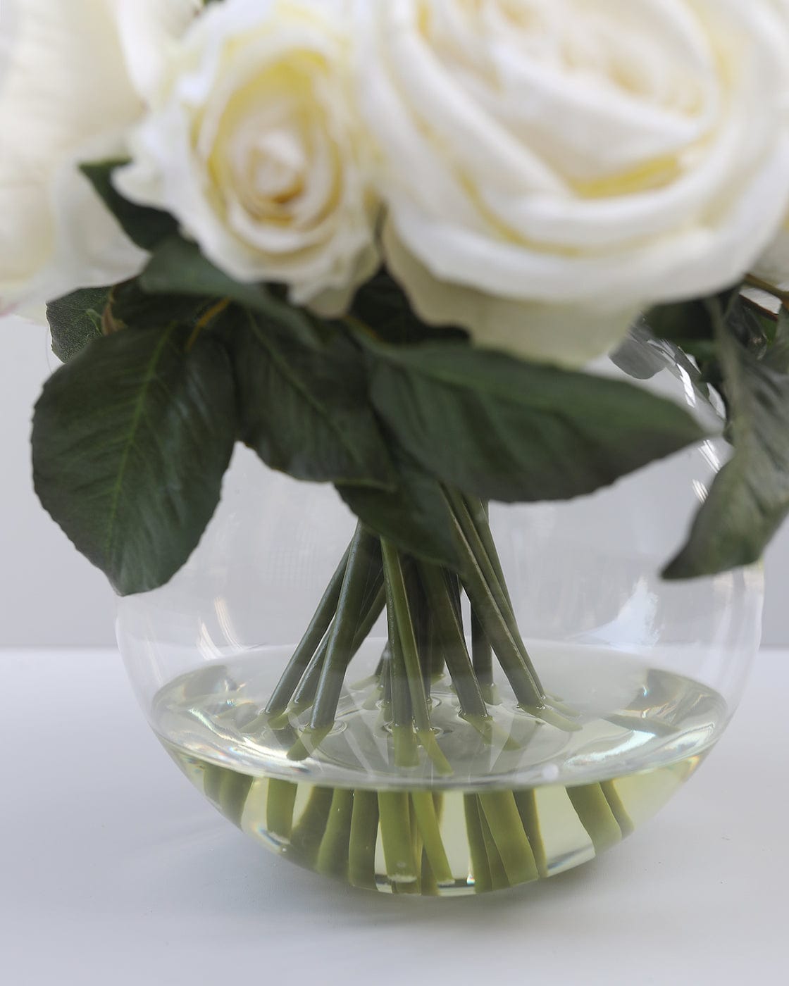 Artificial Roses Styled in Clear Vase with Acrylic Water