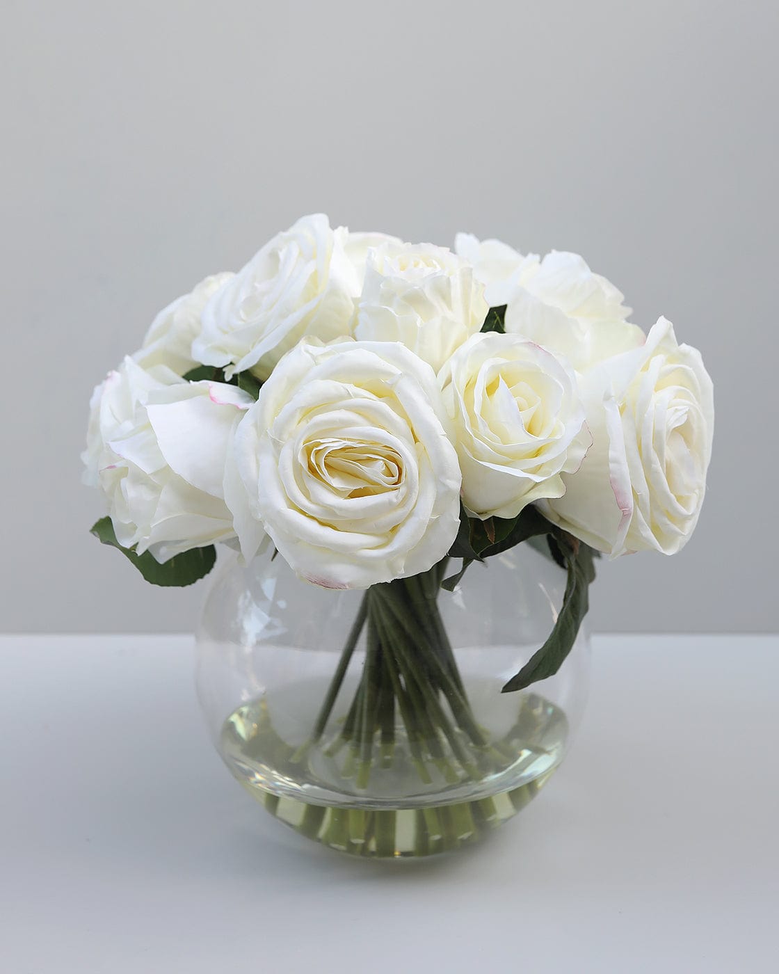 Creamy White Faux Roses Styled in Clear Vase