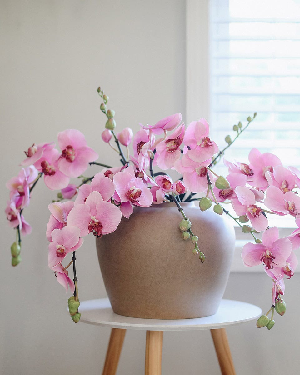 Pink Artificial Orchids Styled for Home Decor in Ceramic Vase