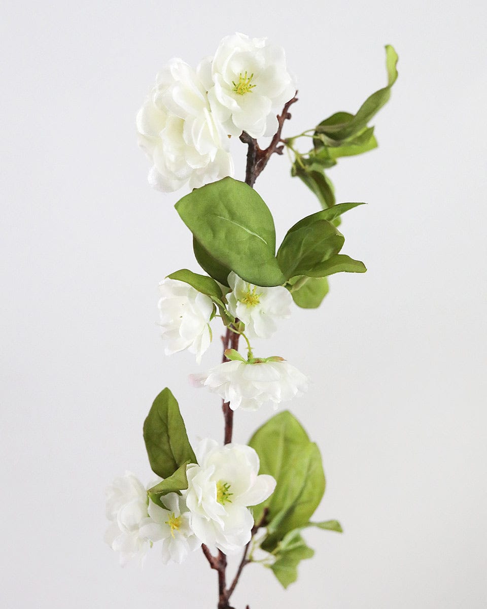 Close of Details of Faux Cherry Blossoms in White