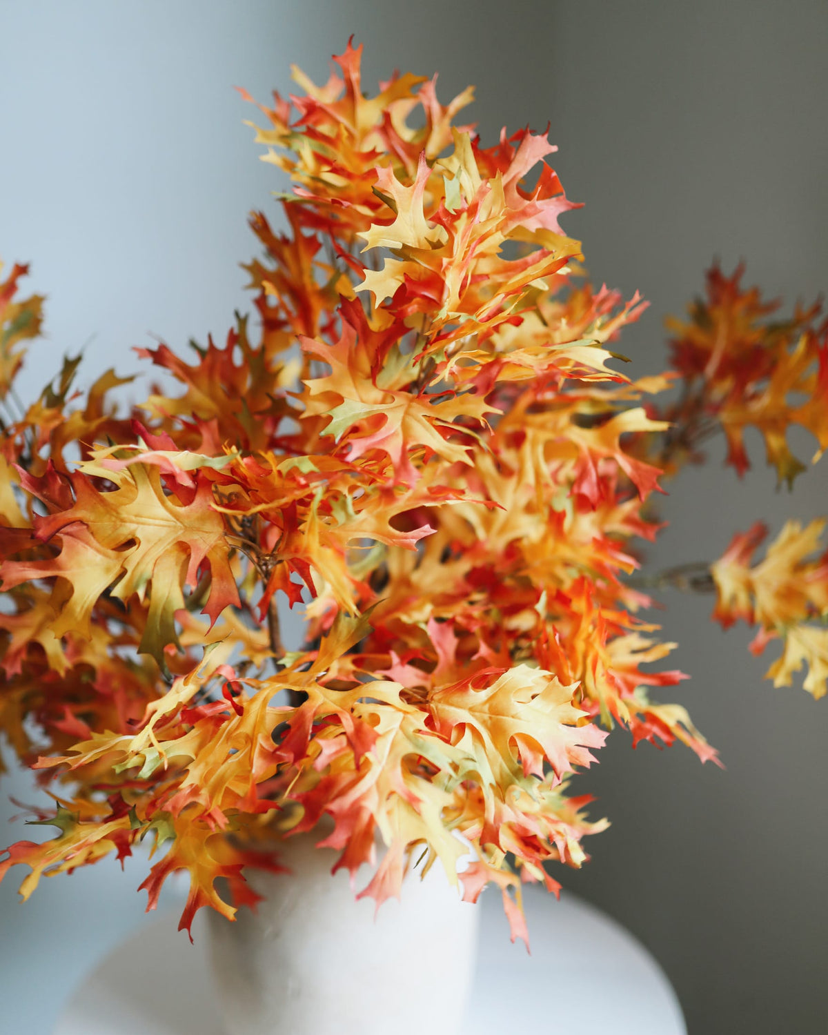 faux orange oak branches close up 