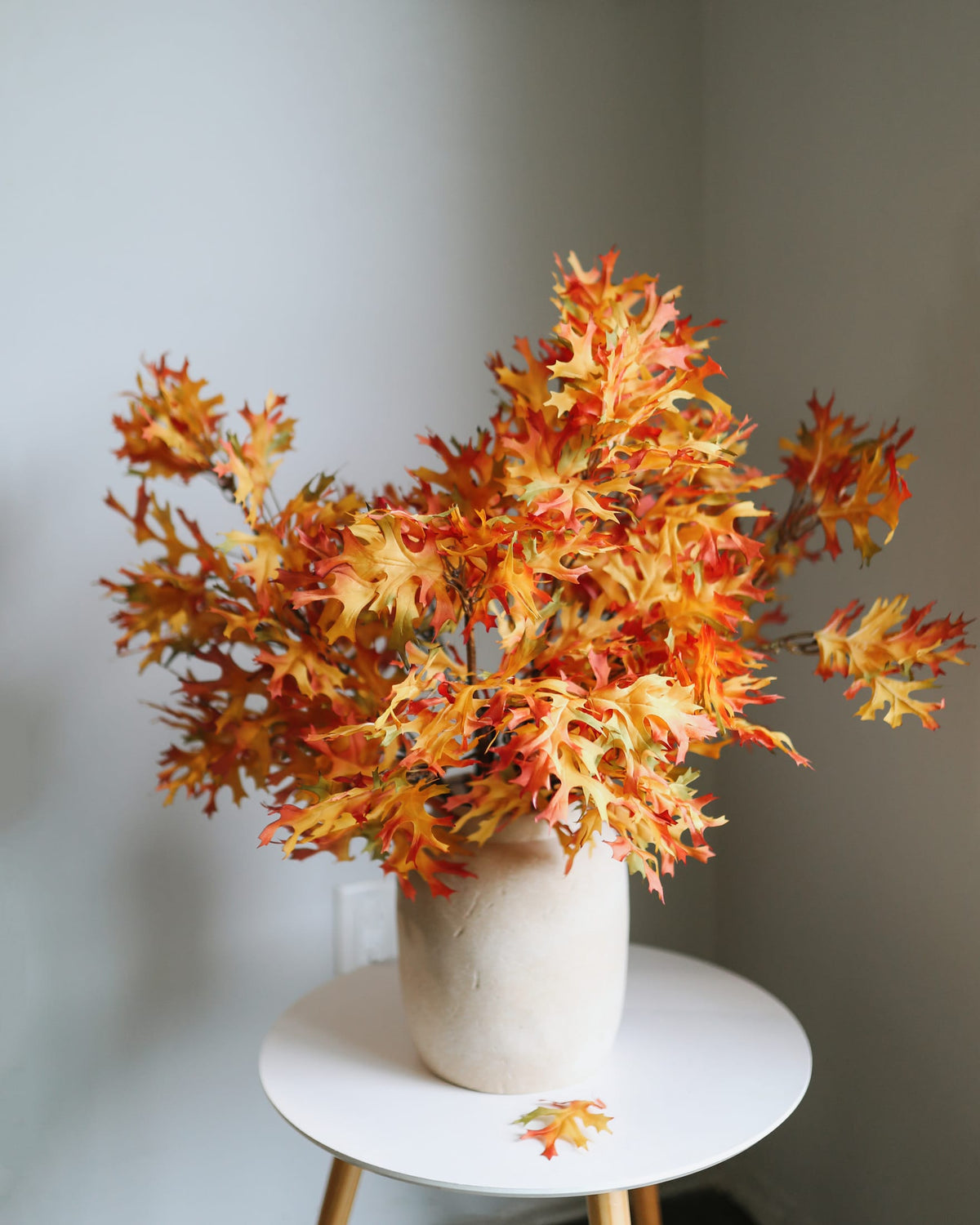 faux oak branches in a vase