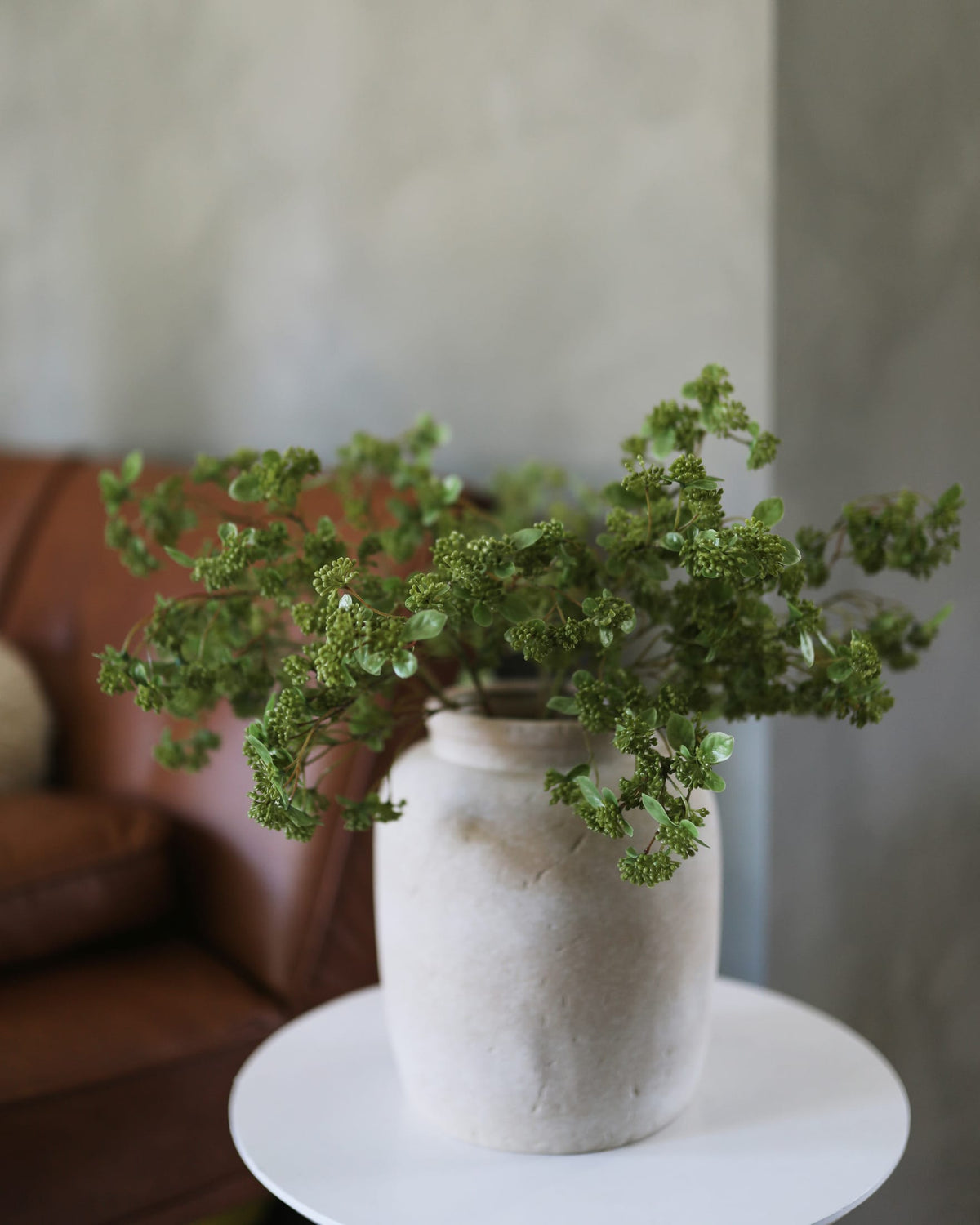 artificial green sedum in a vase