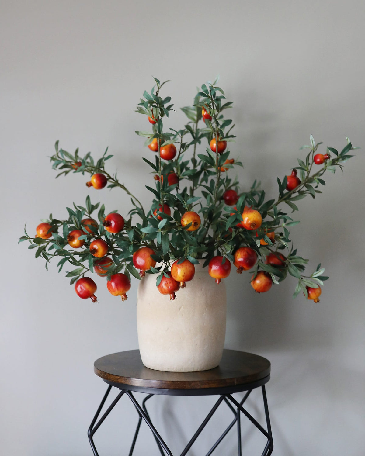 Artificial Pomegranate Branches in a vase