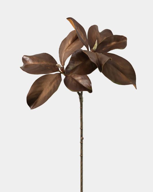 Bronze-colored faux magnolia sculpture on a white background