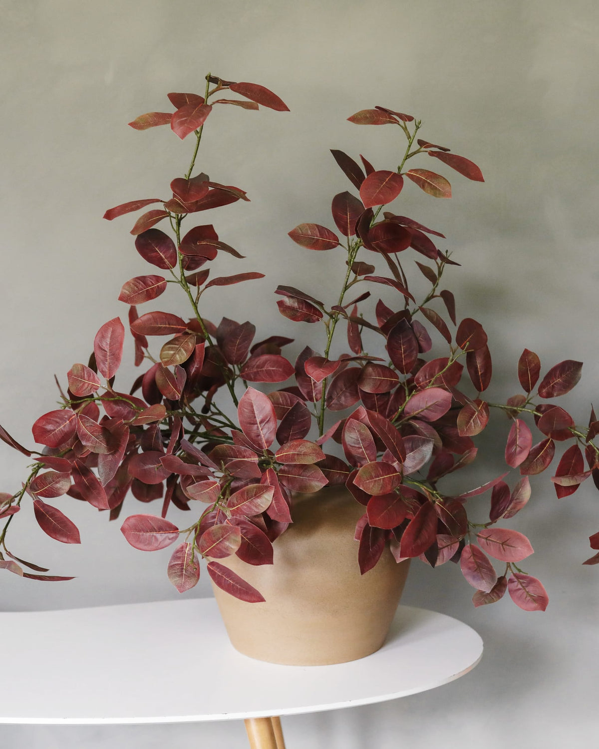 Faux Burgundy Smoke tree branches in a vse