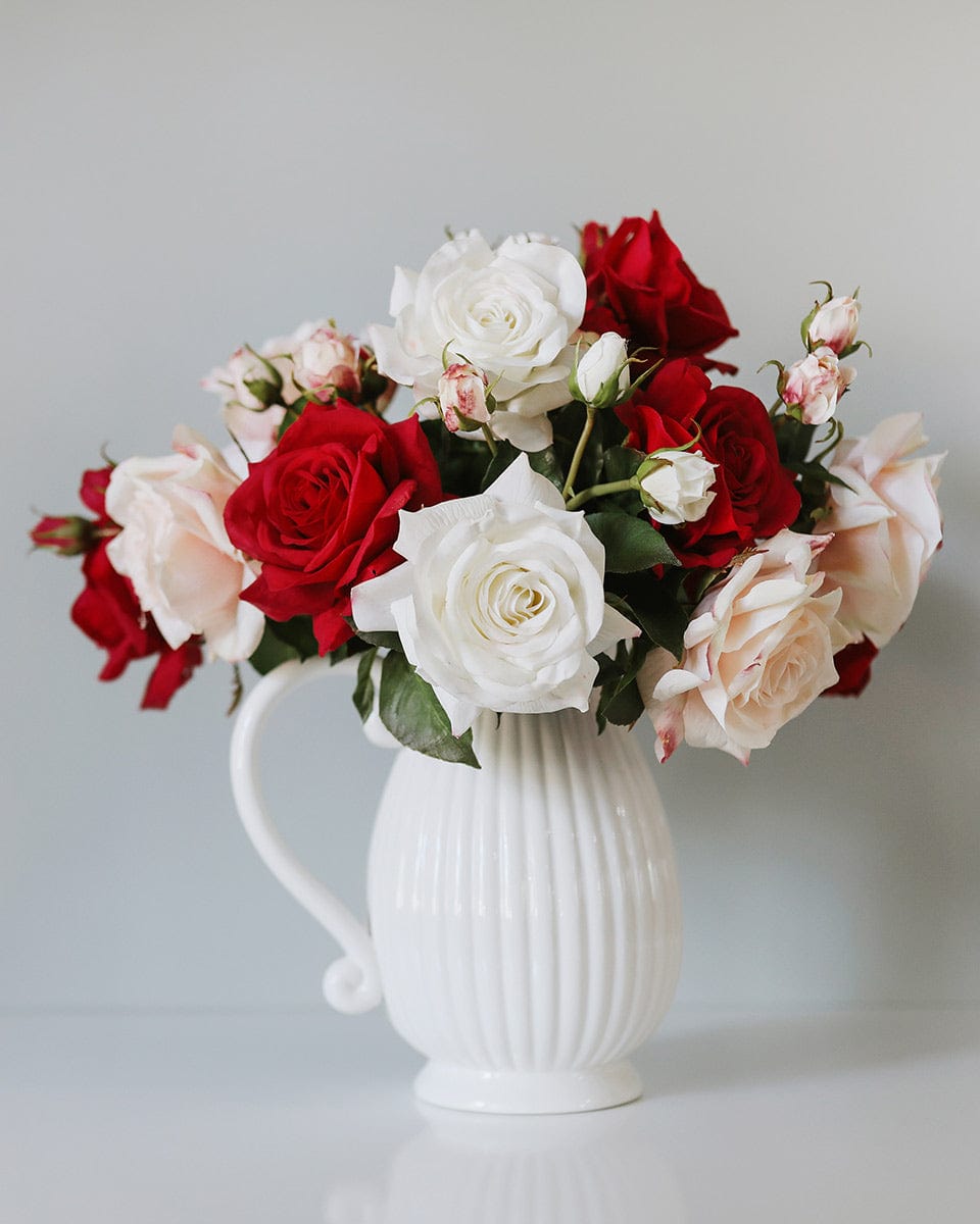 White Red and Pink Valentines Roses in White Pitcher Vase