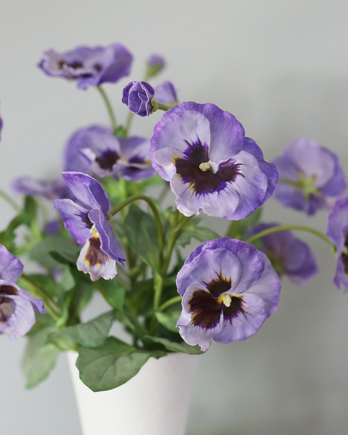 Artificial Purple Pansies in a vase