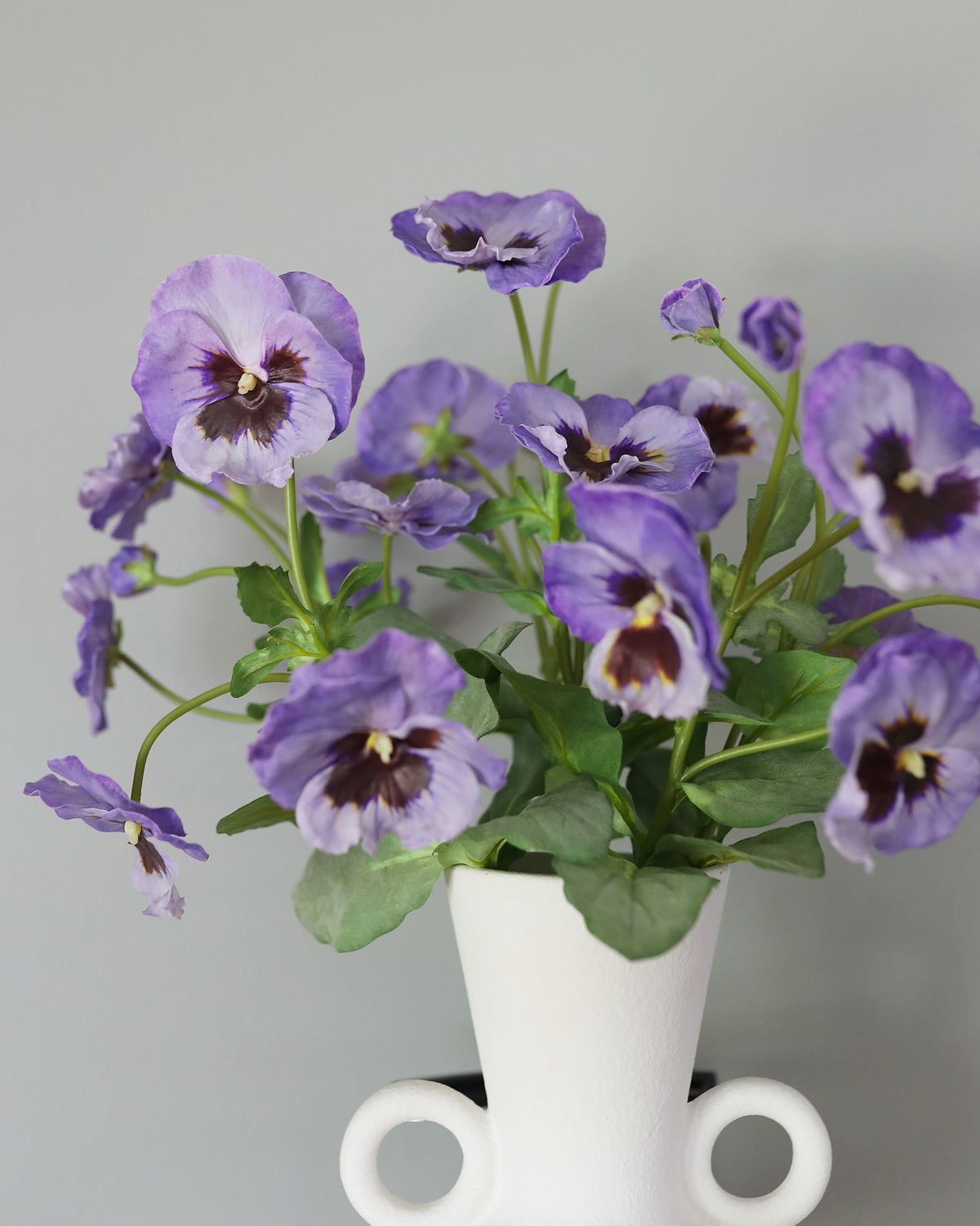 Artificial Purple Pansies in a vase