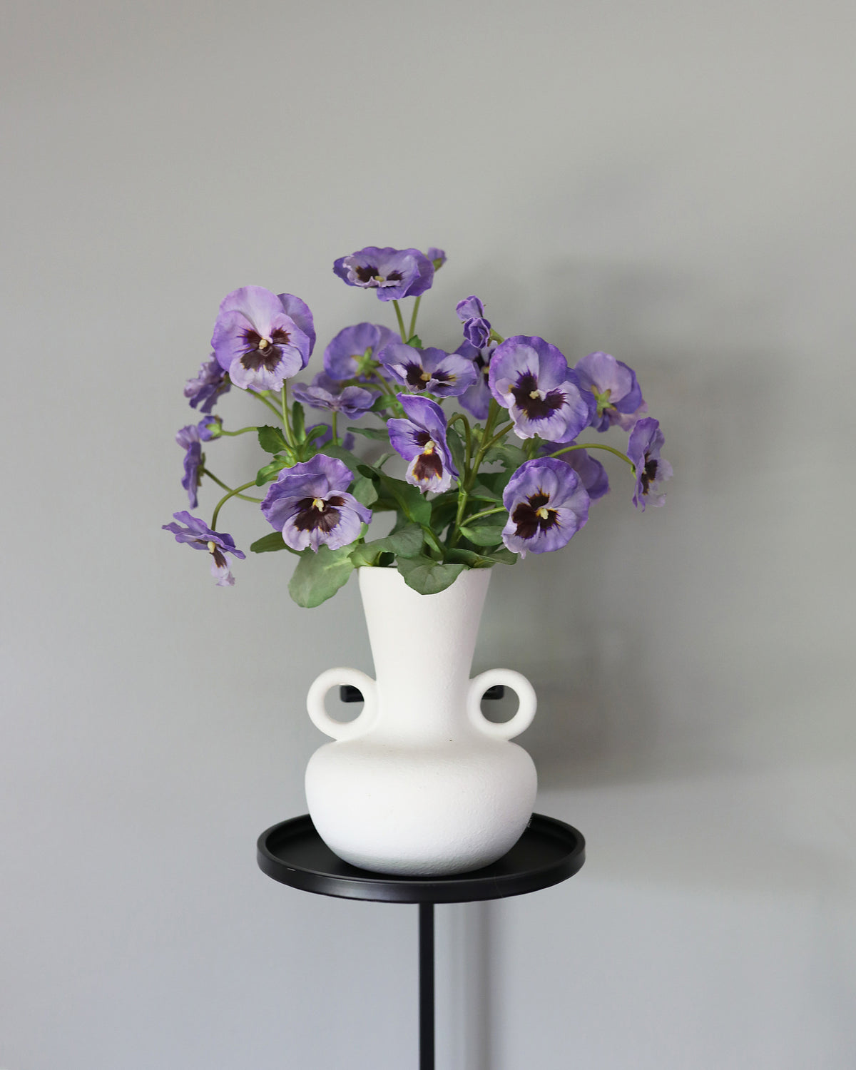 Artificial Purple Pansies in a vase