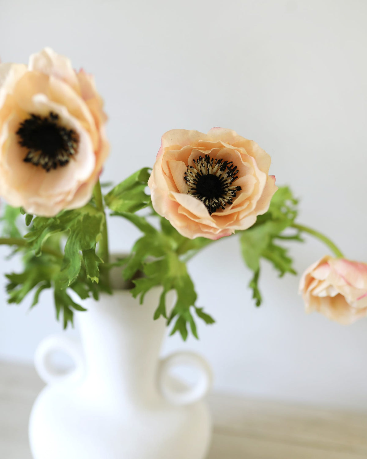 faux pale blush anemones in a vase