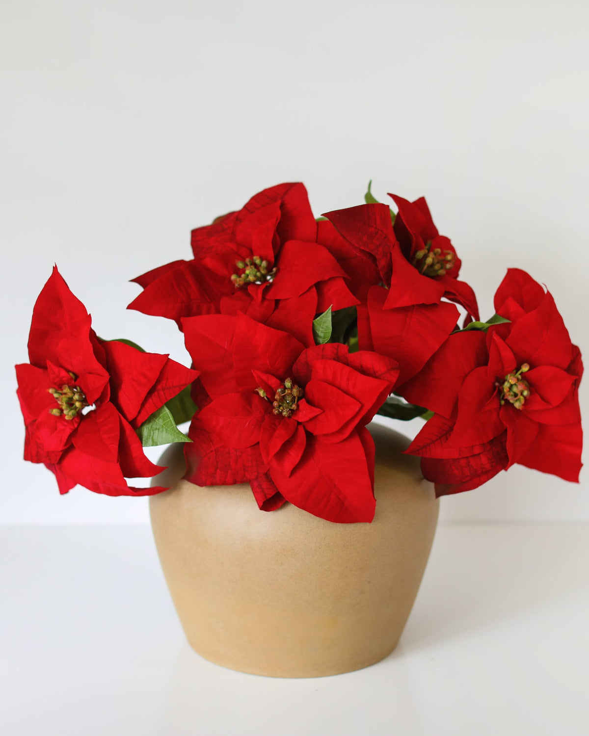 Artificial Red Poinsettias in a vase
