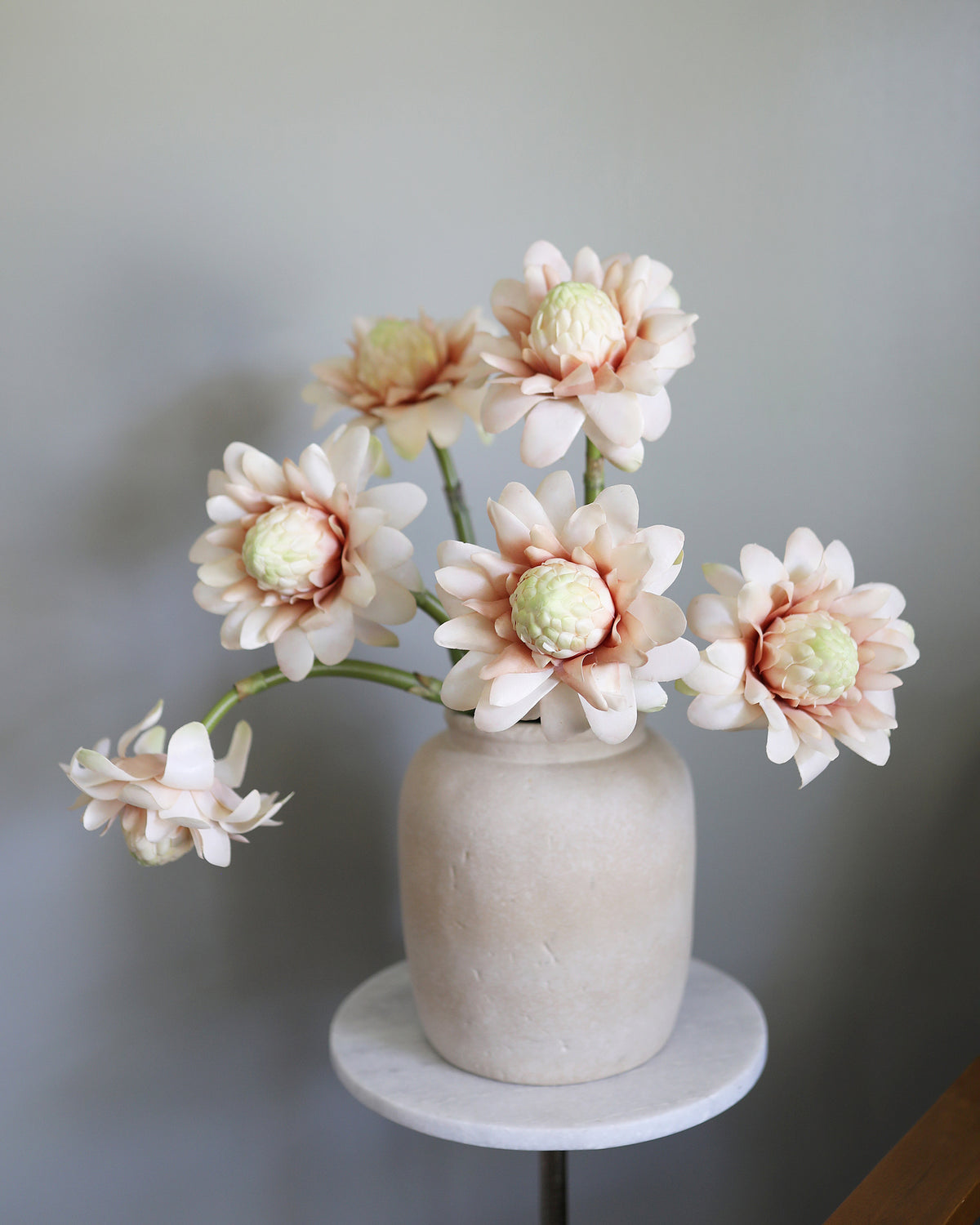 Artificial Pink Protea Blossoms in a vase