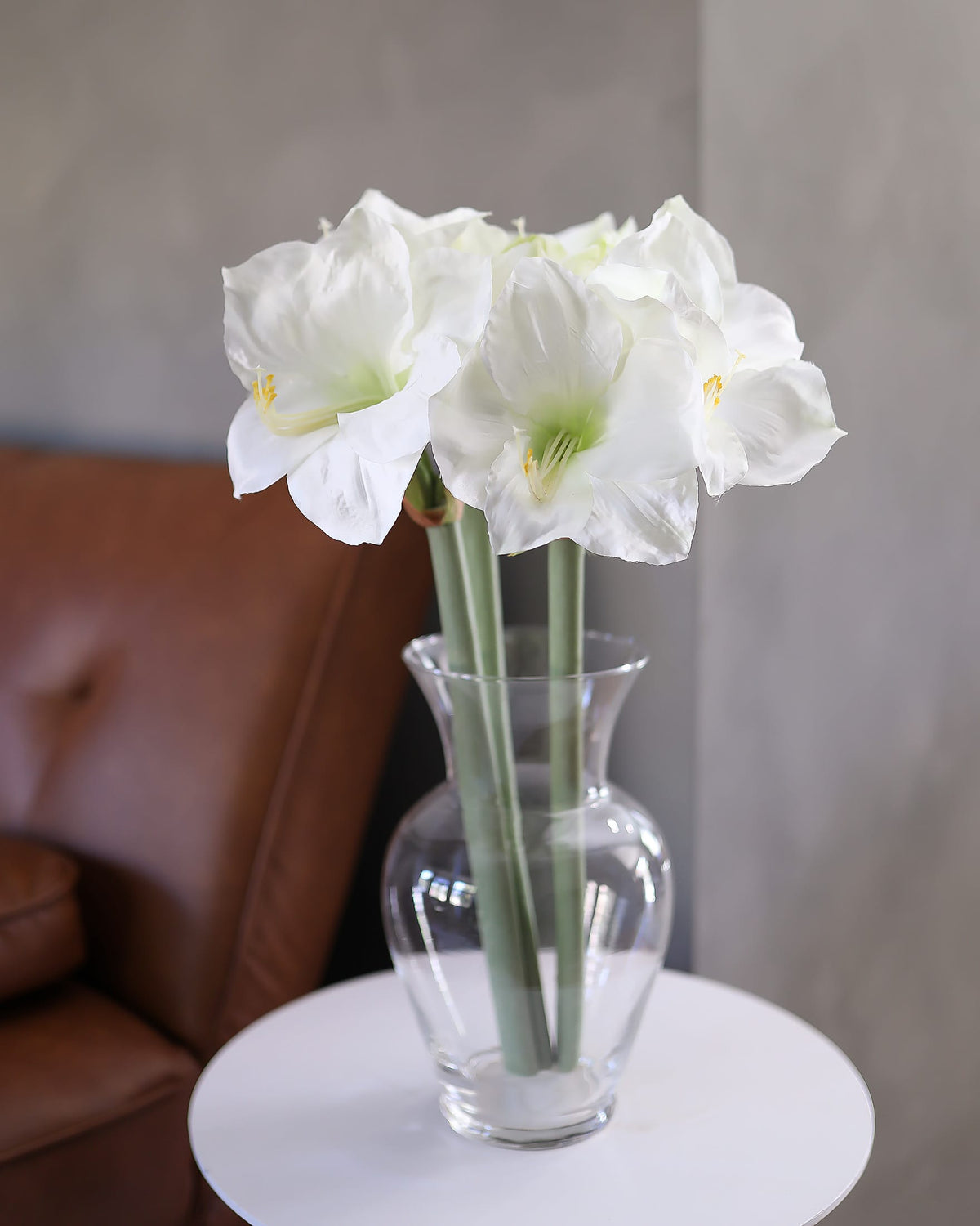 White Faux Amaryllis stems in a vase