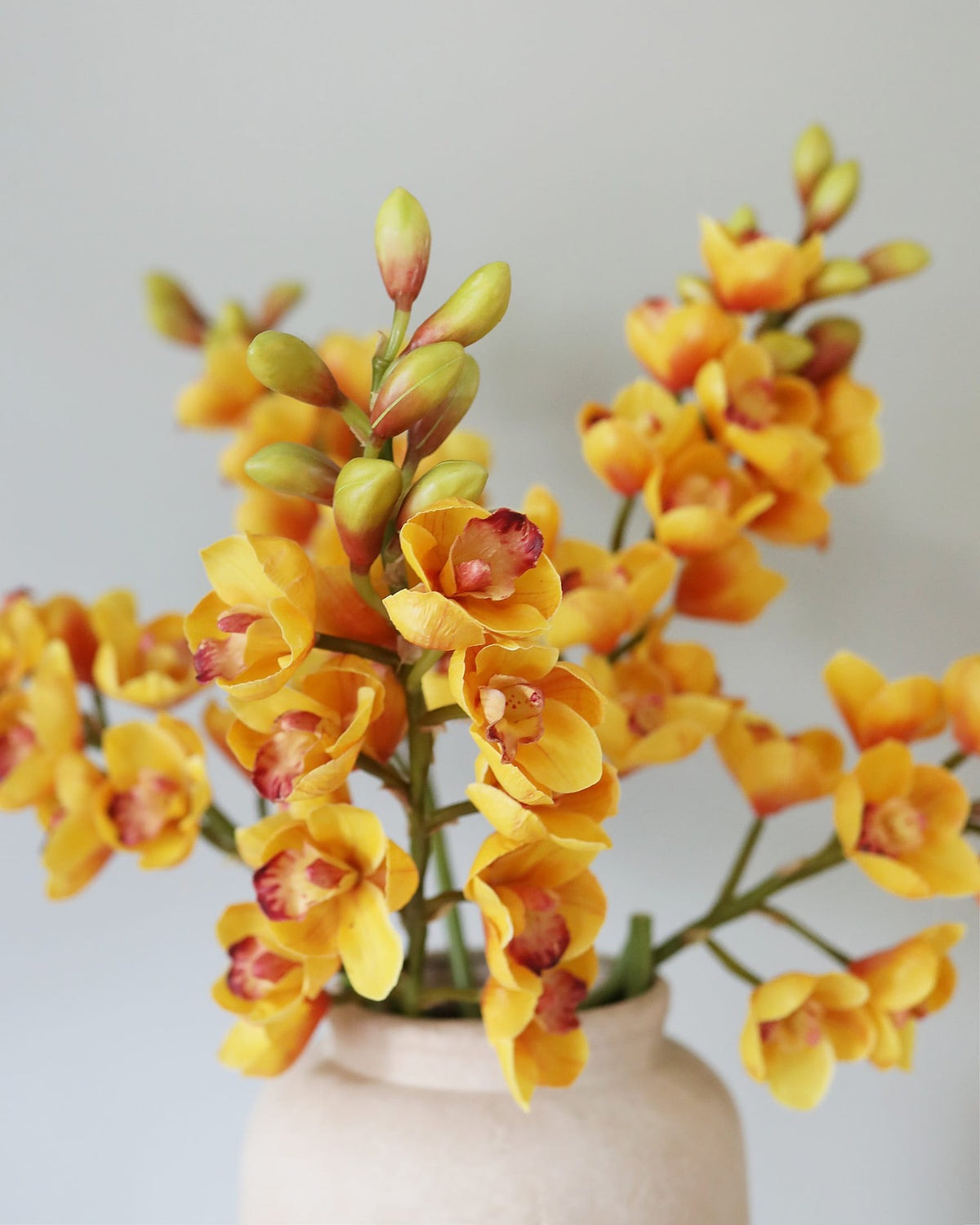 Faux Yellow Cymbidium Orchids in a vase