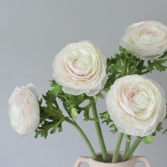 Video Showcasing Cream Artificial Ranunculus Flowers in Vase