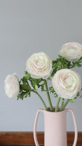 Video Showcasing Cream Artificial Ranunculus Flowers in Vase