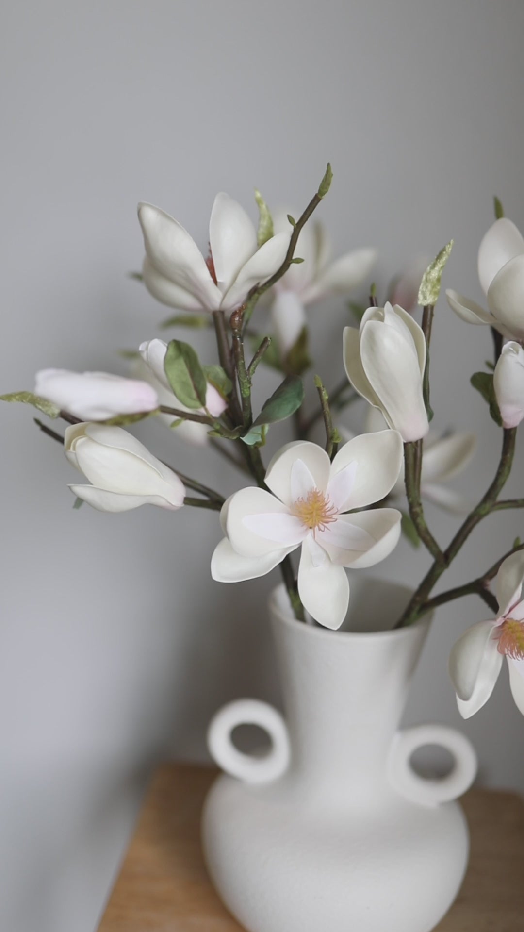 Video Showcasing Artificial White Magnolia Stems in Vase