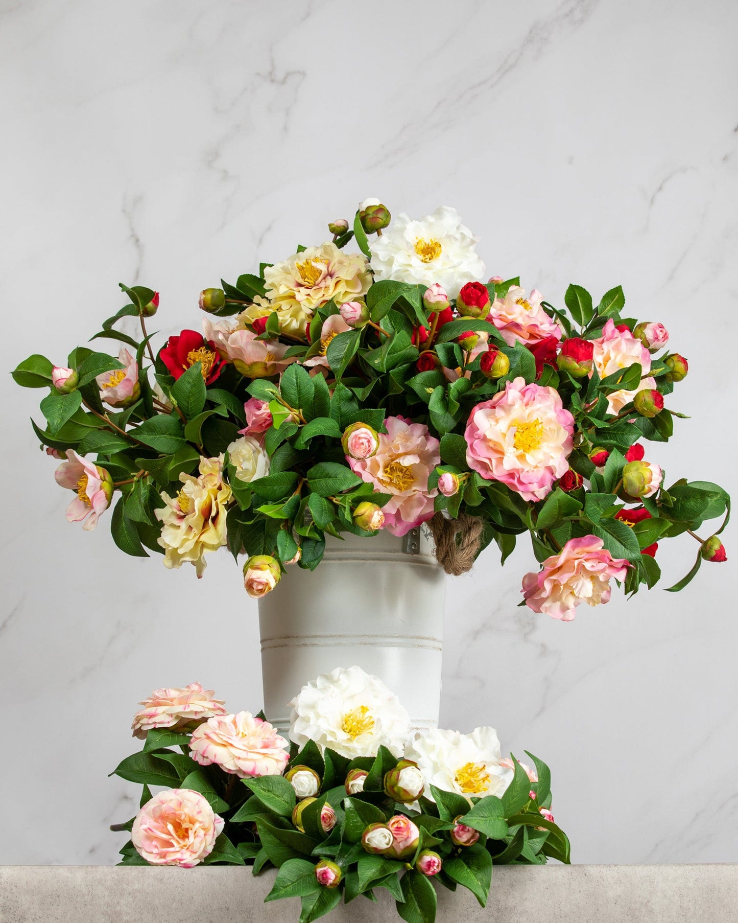 Prestige Botanicals Artificial Camellia bouquet in a white tin vase