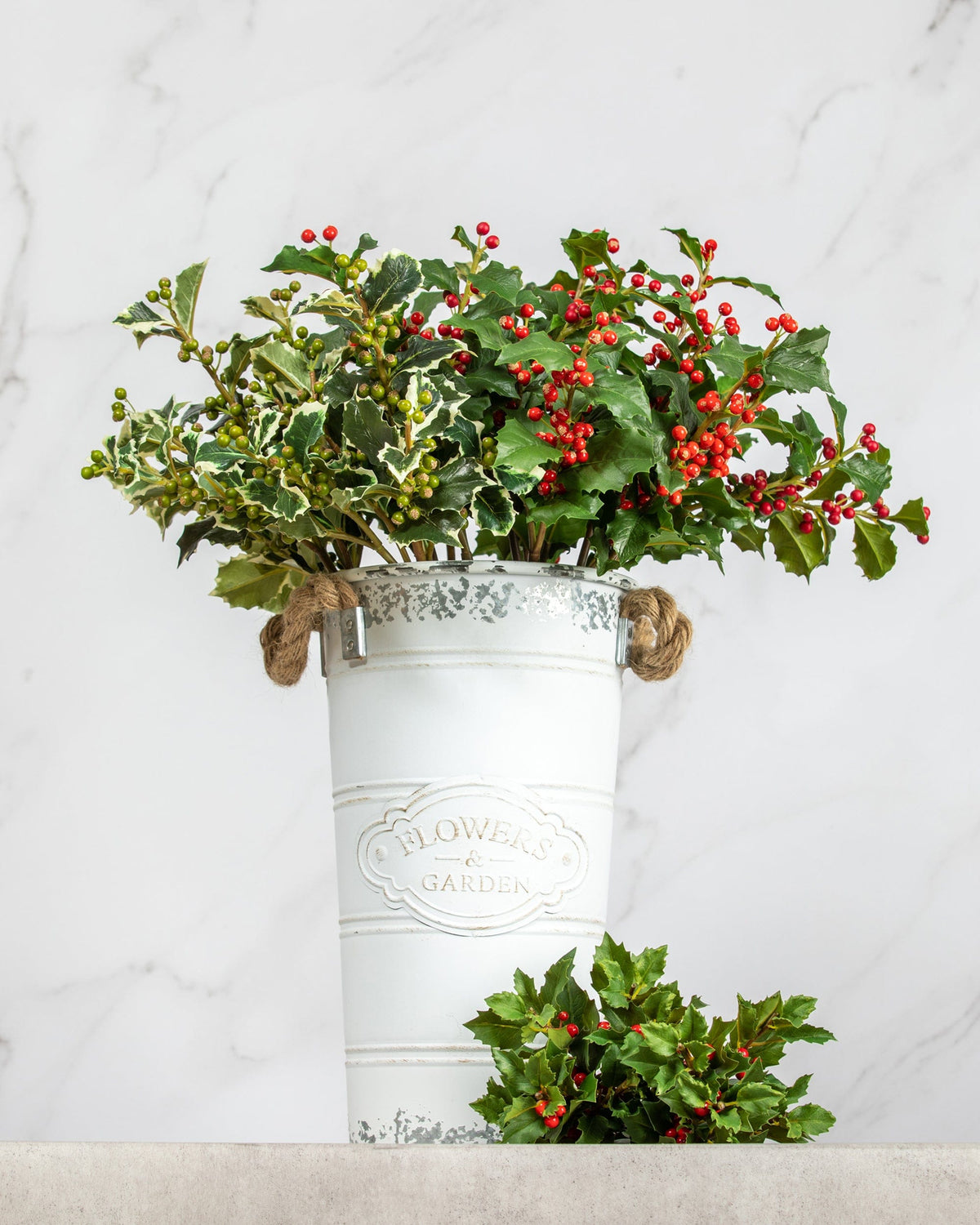 Prestige Botanicals Artificial Holly stems in a white tin vase