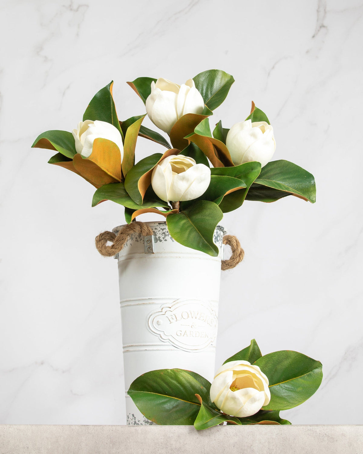 Prestige Botanicals Artificial White Magnolia cups in a white tin vase