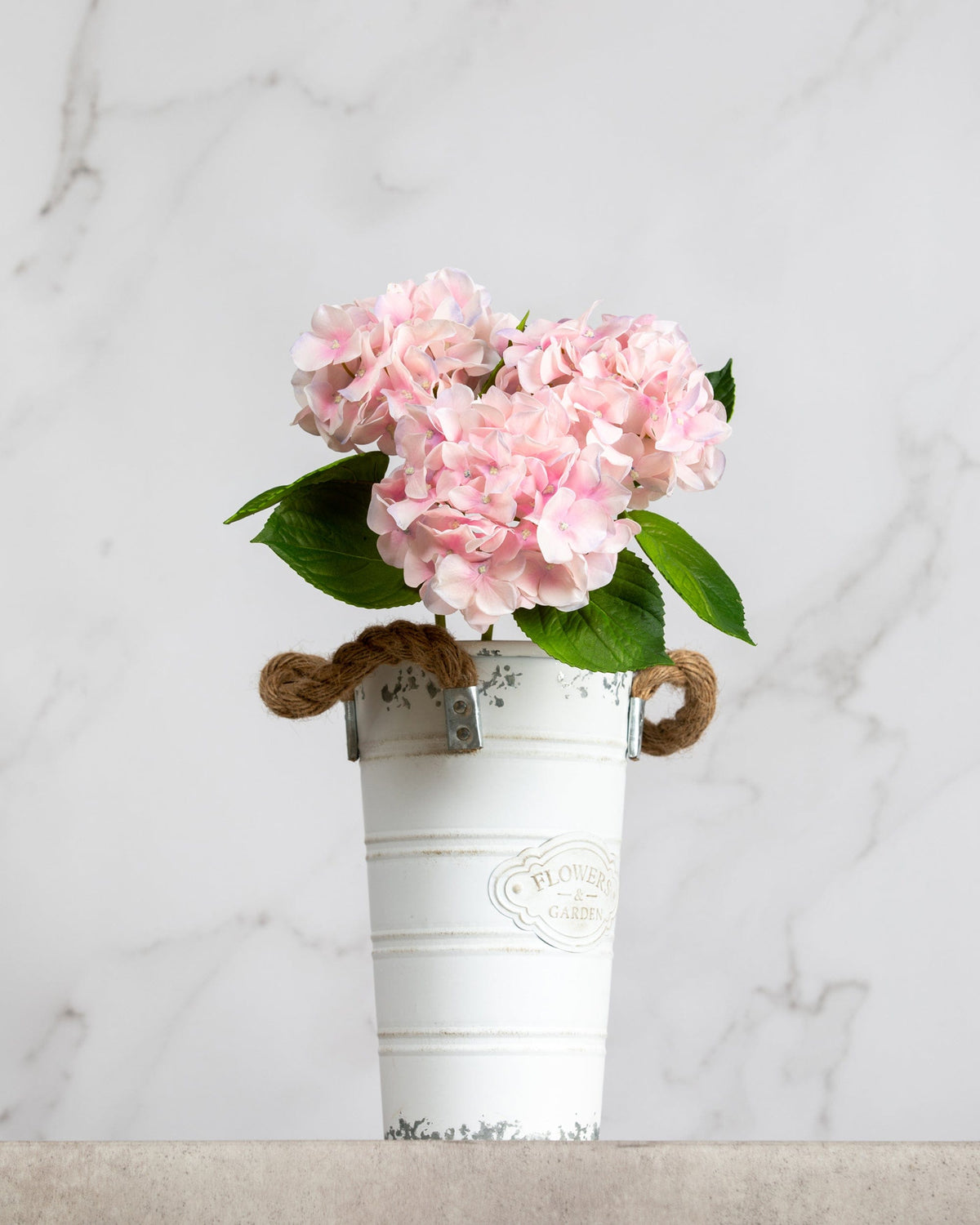 Prestige Botanicals Artificial Small Pink Hydrangea Stems in a small white tin vase