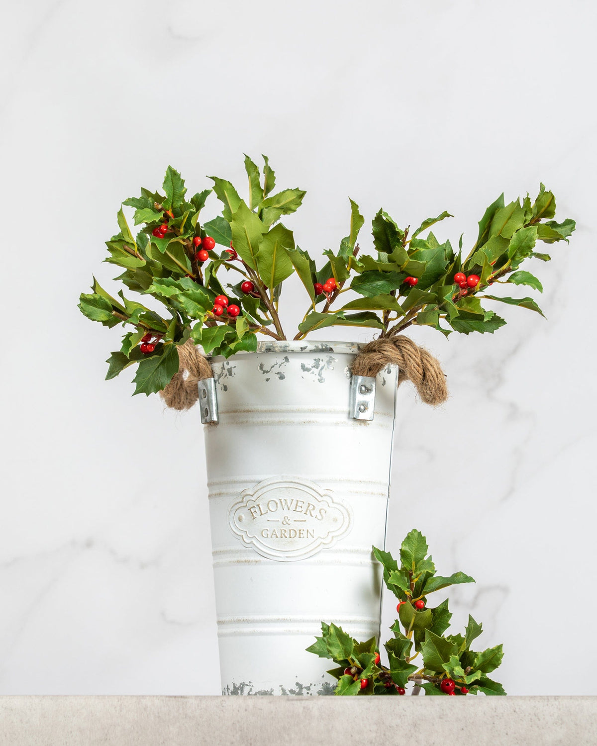 Prestige Botanicals Small Artificial Holly stems in a white tin vase