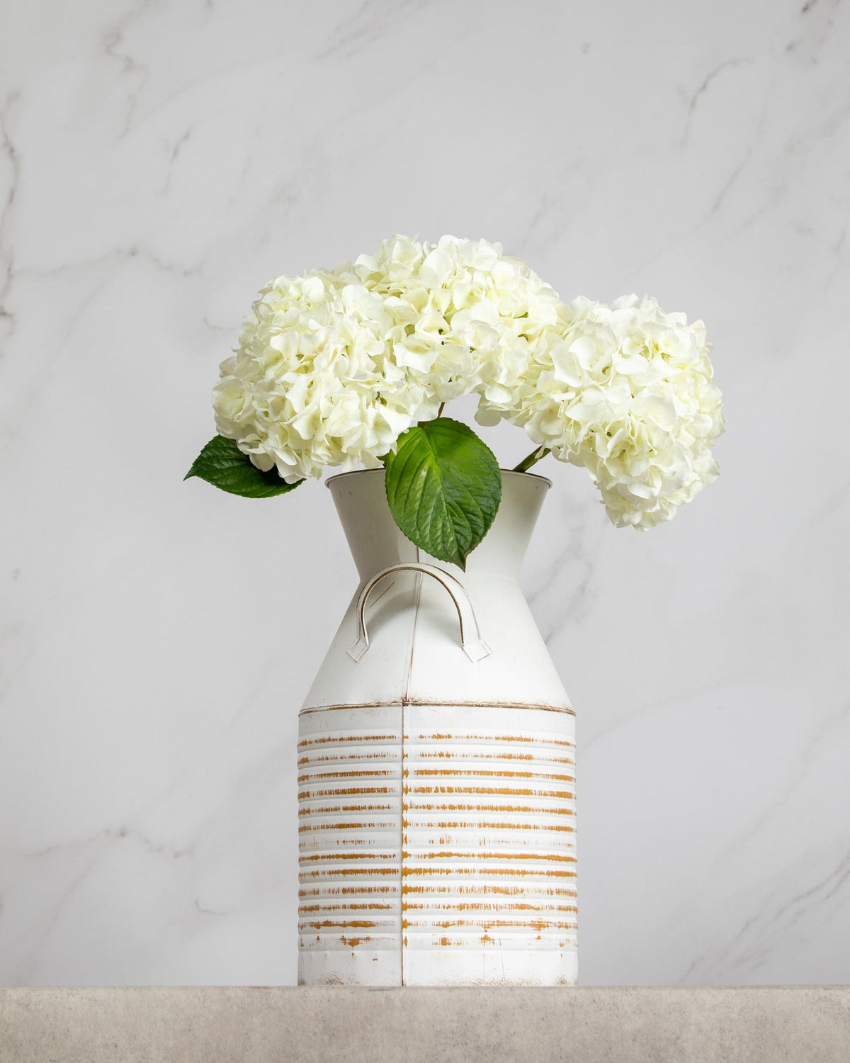 Prestige Botanicals Artificial Long White Hydrangea stems in a white tin vase