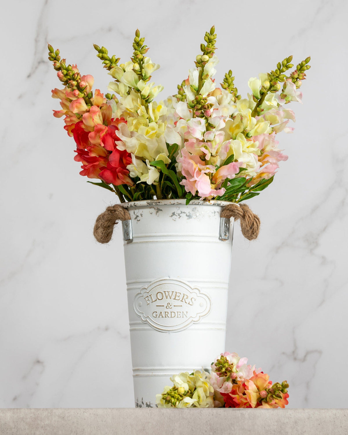 Prestige Botanicals Artificial White, Pink, Orange and Yellow Snapdragons in a white tin vase