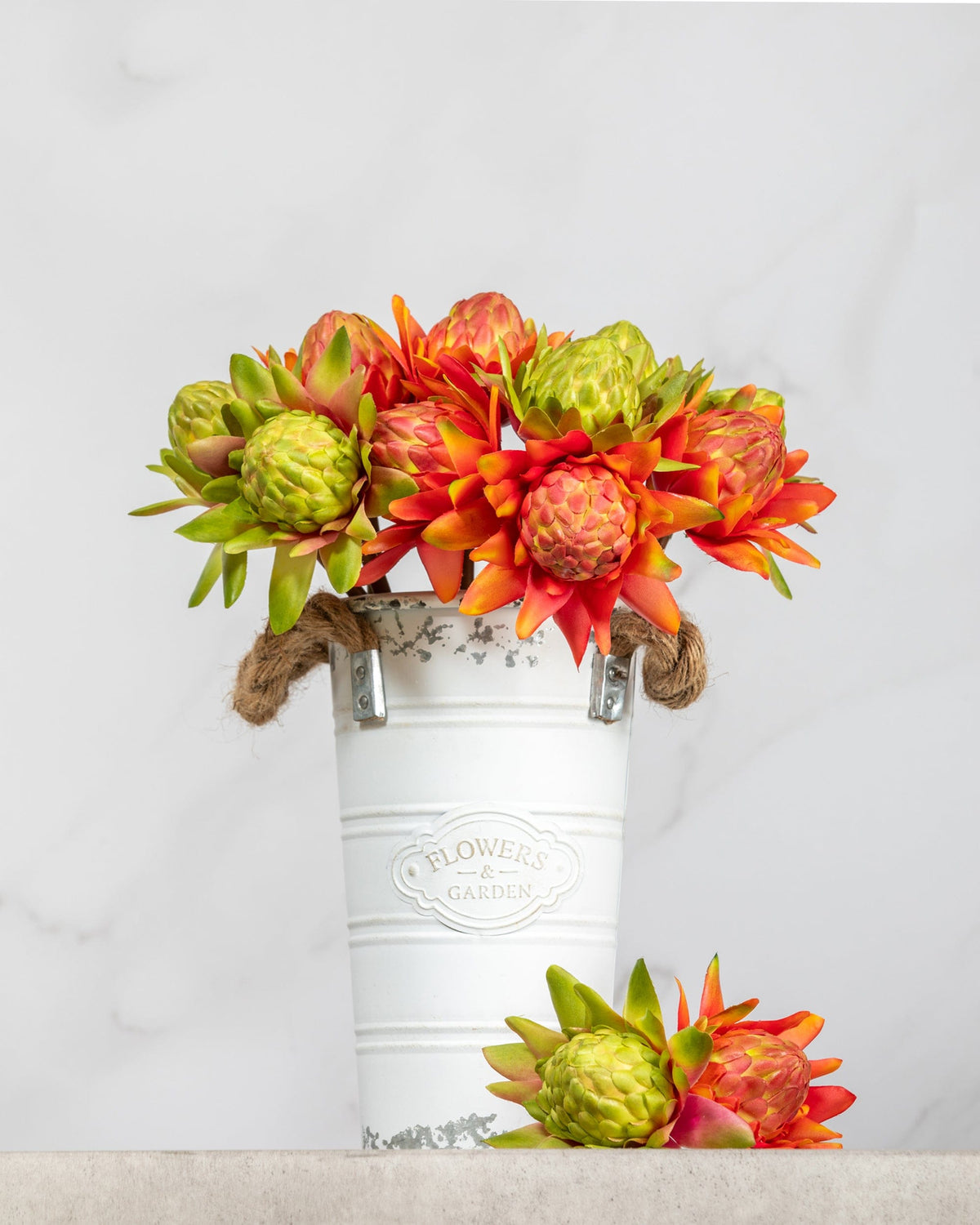 Prestige Botanicals Artificial Orange and Green Waratahs in a tin vase